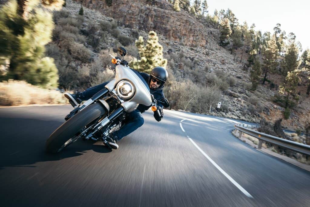 harley rider taking a mountain turn fast